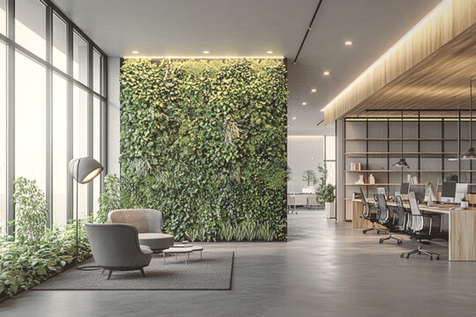 A bright, healthy workplace with a living green wall, floor-to-ceiling windows, a lounge corner and open-plan workstations